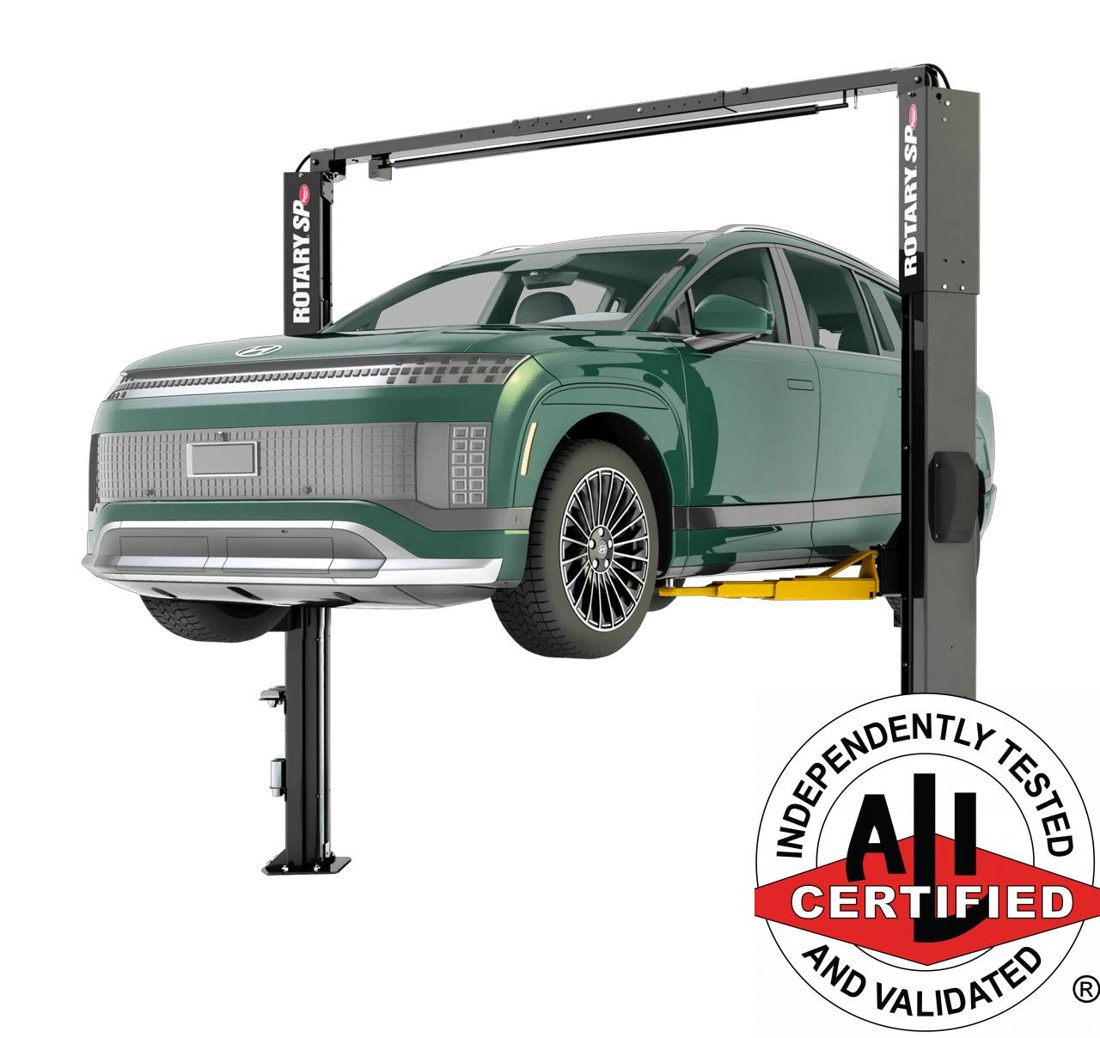 Rotary two-post automotive lift in a service bay