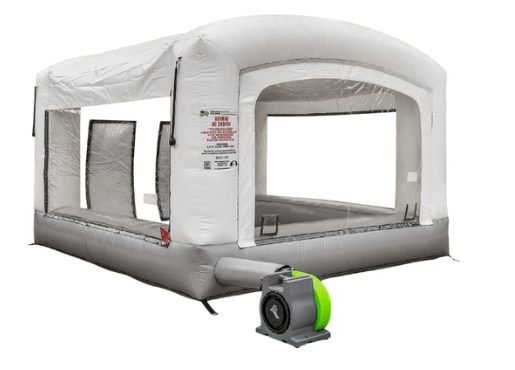 Inflatable paint booth set up in a home garage